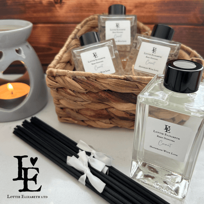 A reed diffuser labeled "Coconut," featuring natural reed sticks in a sleek glass bottle. The scent combines the tropical aroma of fresh coconut with warm undertones, creating a refreshing and inviting fragrance for a cozy home environment.