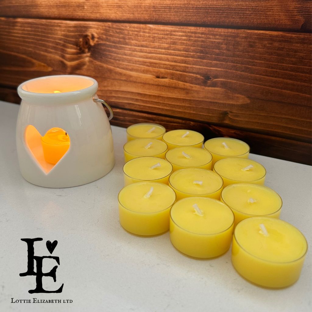 Close-up of 12 Heavenly Nectar tealight candles made from natural soy wax.