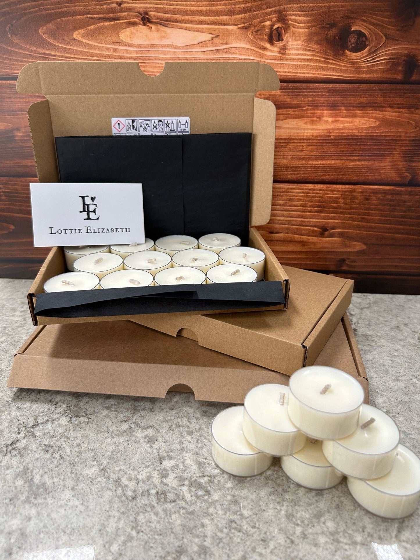 Image of our Lottie Elizabeth Ltd letterbox tea lights candles: Sustainably packaged. Perfect for weddings, events, and gifts. Made from natural soy wax. Keywords: tea light, tea lights, tealights, nature, soy wax, soywax, vegan, eco-friendly, unscented candle, 6, 12, 24. GLIMMA. Picture of 2 variants 12 and individual